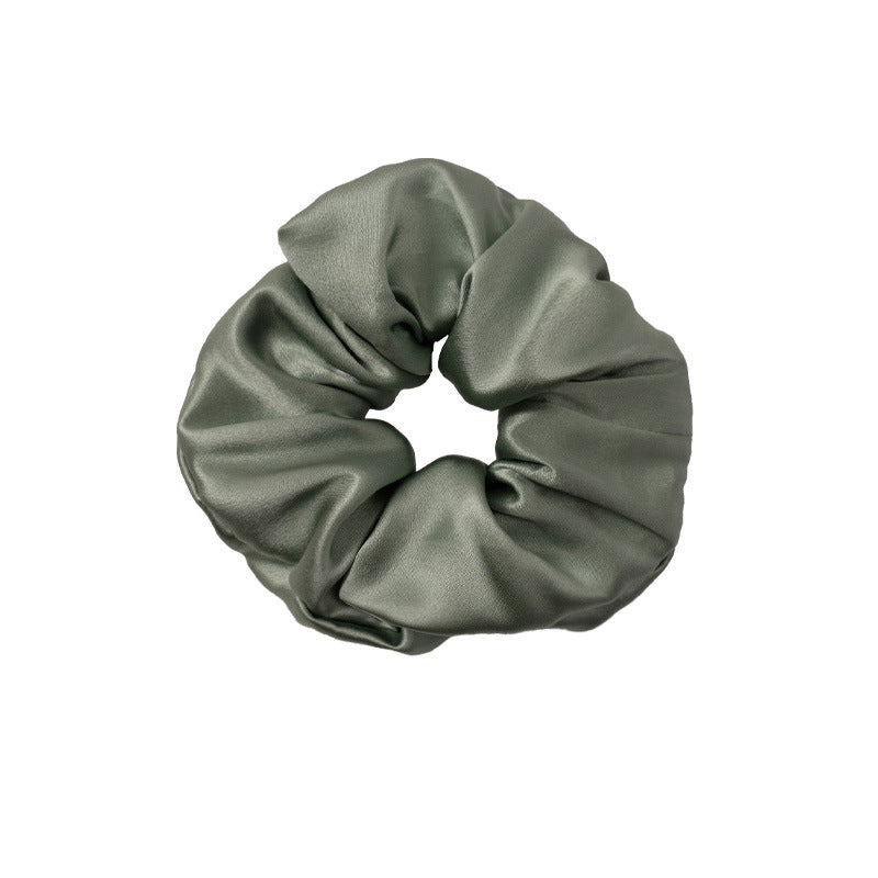 A set of silk scrunchies in various colors including beige, blue, brown, and more-5