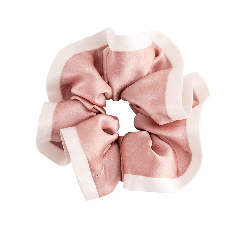 A set of colorful 100% silk scrunchies in beige, black, blue, green, and pink-5