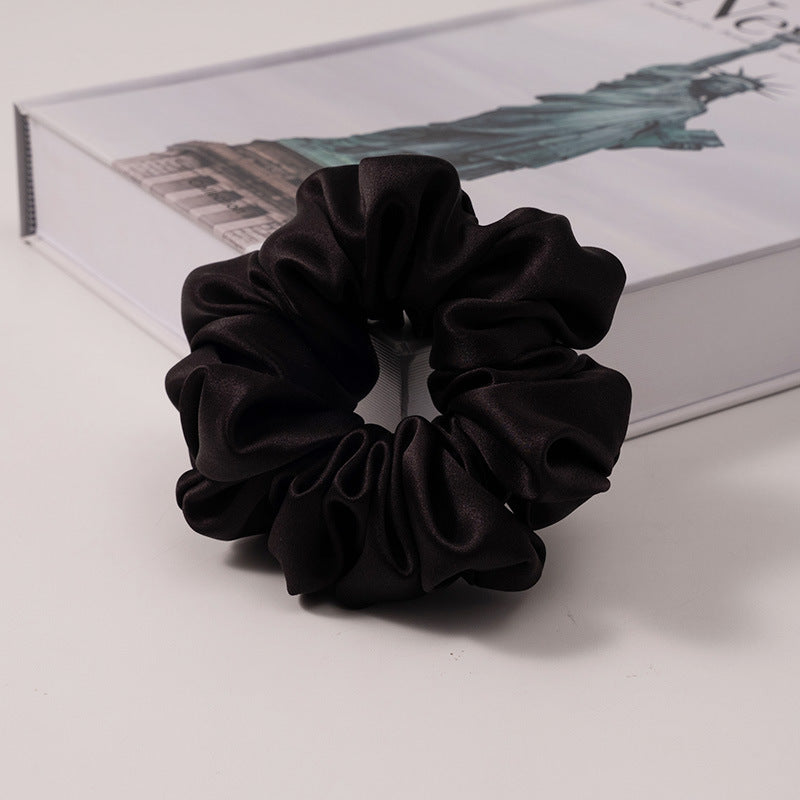A set of silk scrunchies in various colors including beige, blue, brown, and more-34