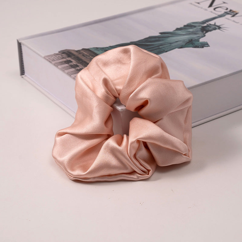 A set of silk scrunchies in various colors including beige, blue, brown, and more-39