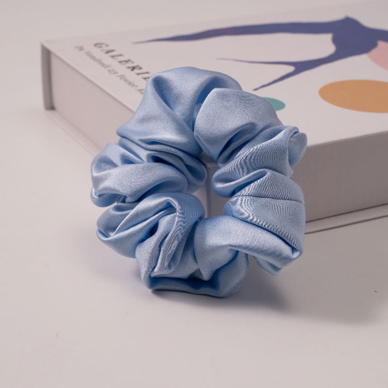 A set of silk scrunchies in various colors including beige, blue, brown, and more-25