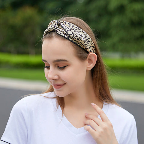 Orange geometric patterned 100% silk headband on a woman-22