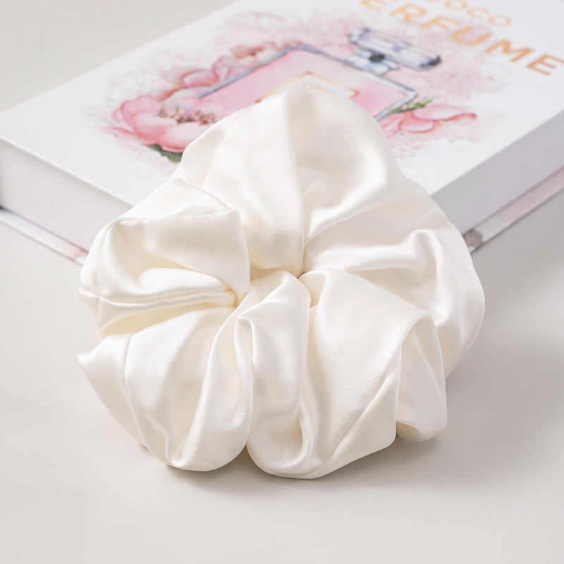 A set of silk scrunchies in various colors including beige, blue, brown, and more-48