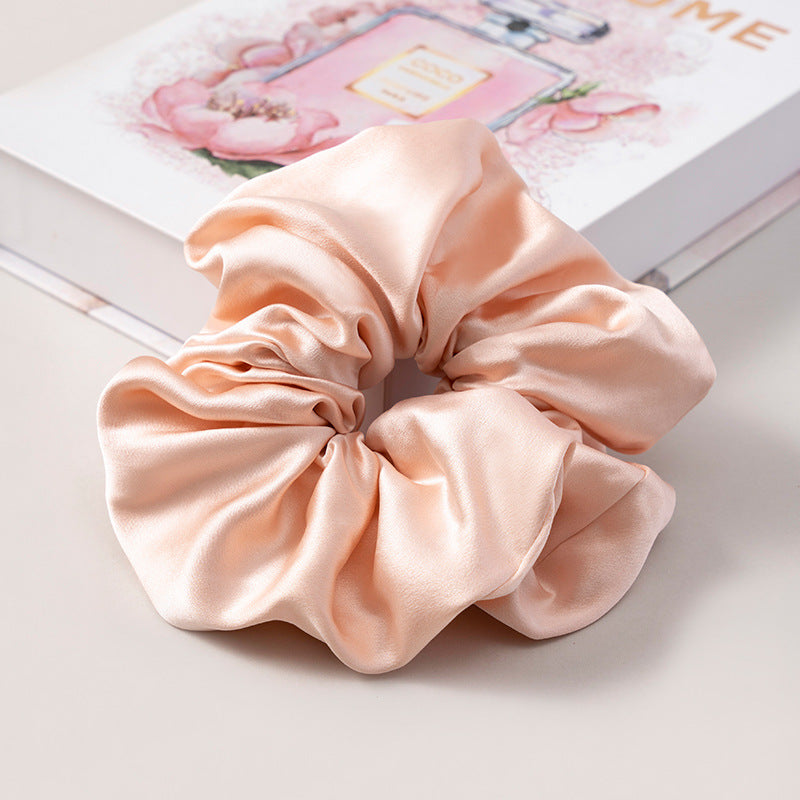 A set of silk scrunchies in various colors including beige, blue, brown, and more-52