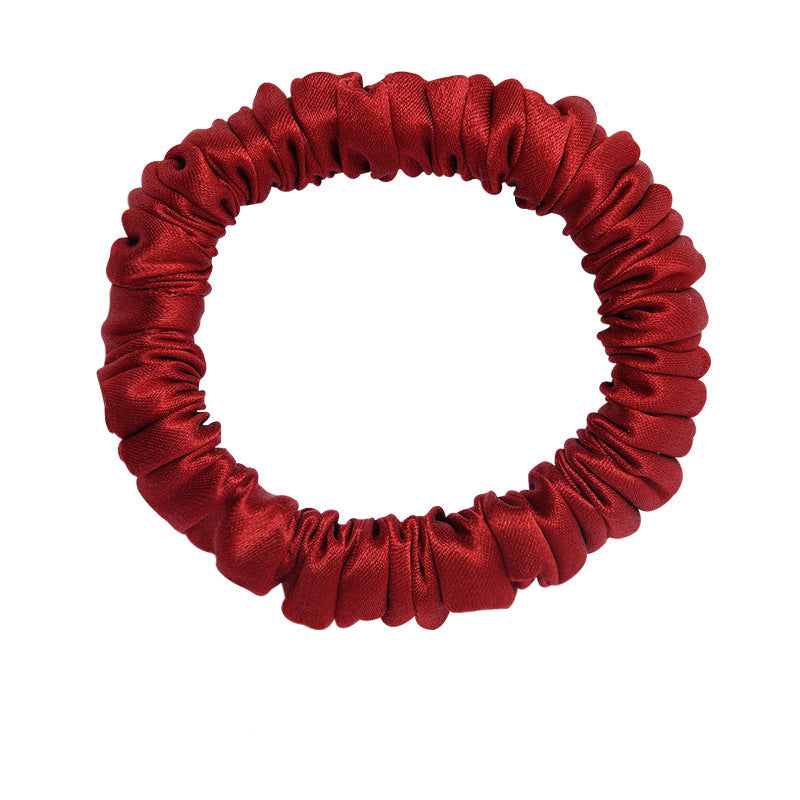 A set of silk scrunchies in black, gray, beige, brown, light blue, pink, and green colors-12