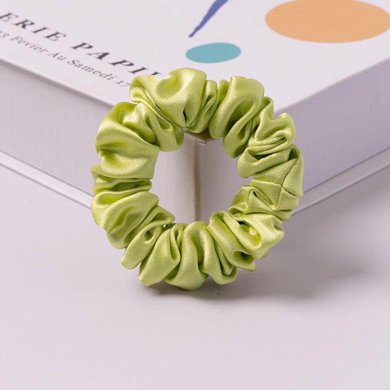 A set of silk scrunchies in various colors including beige, blue, brown, and more-16