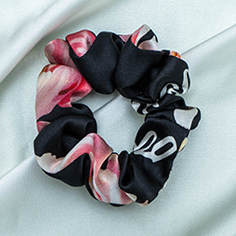 A collection of colorful 100% silk scrunchies-8