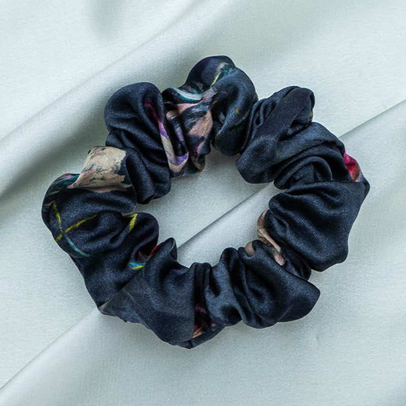 A collection of colorful 100% silk scrunchies-7