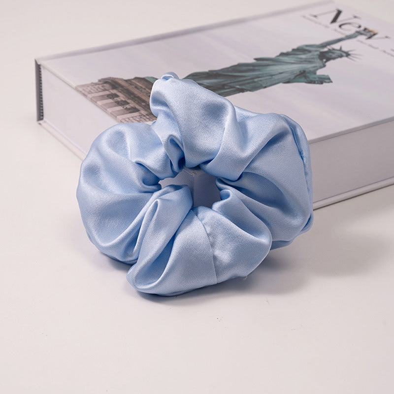 A set of silk scrunchies in various colors including beige, blue, brown, and more-38