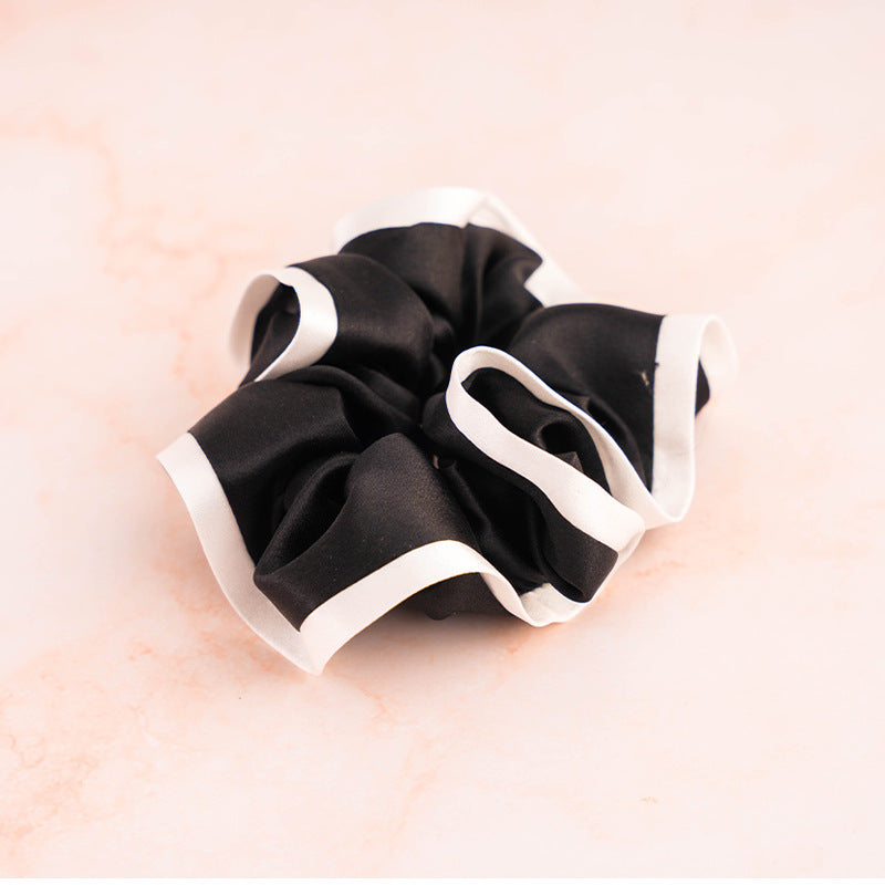 A set of colorful 100% silk scrunchies in beige, black, blue, green, and pink-6