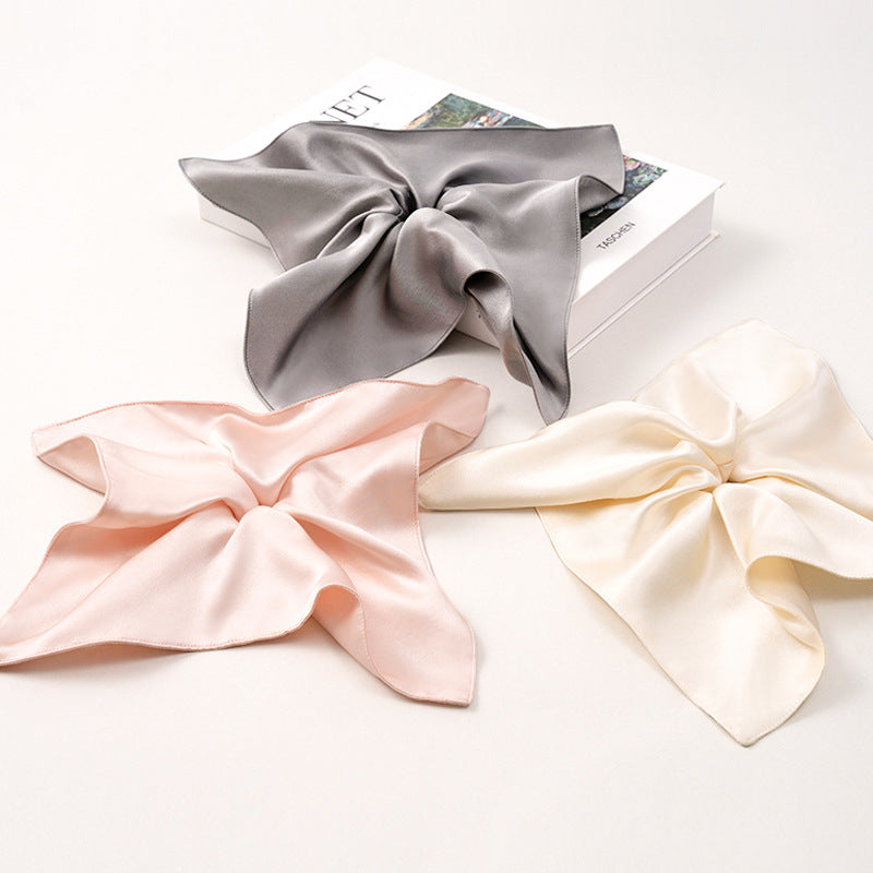 Soft - colored 100% silk scrunchies in gray, pink, and beige