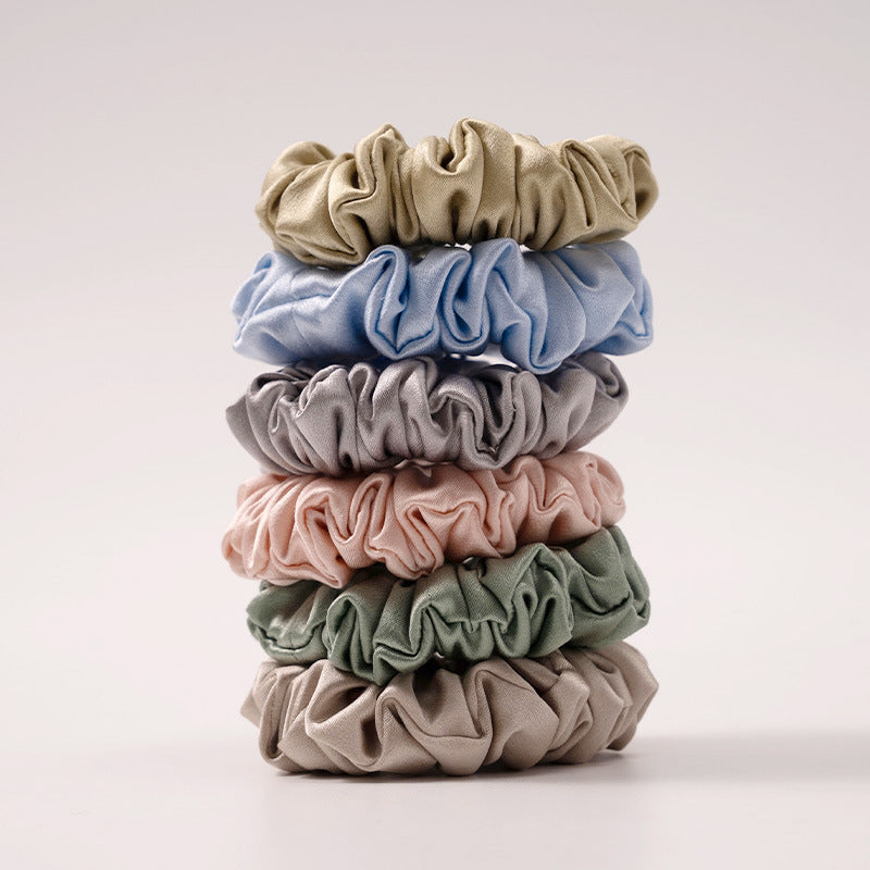 A set of silk scrunchies in black, brown, white, pink, green, and gray colors-2