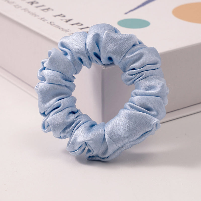 A set of silk scrunchies in black, brown, white, pink, green, and gray colors-3
