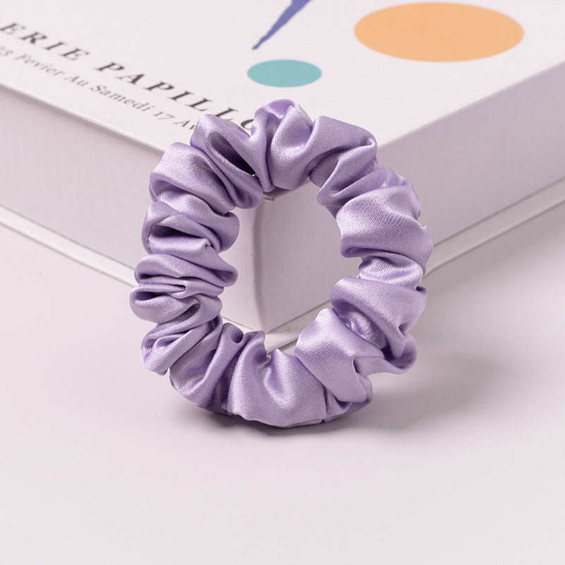 A set of silk scrunchies in various colors including beige, blue, brown, and more-18