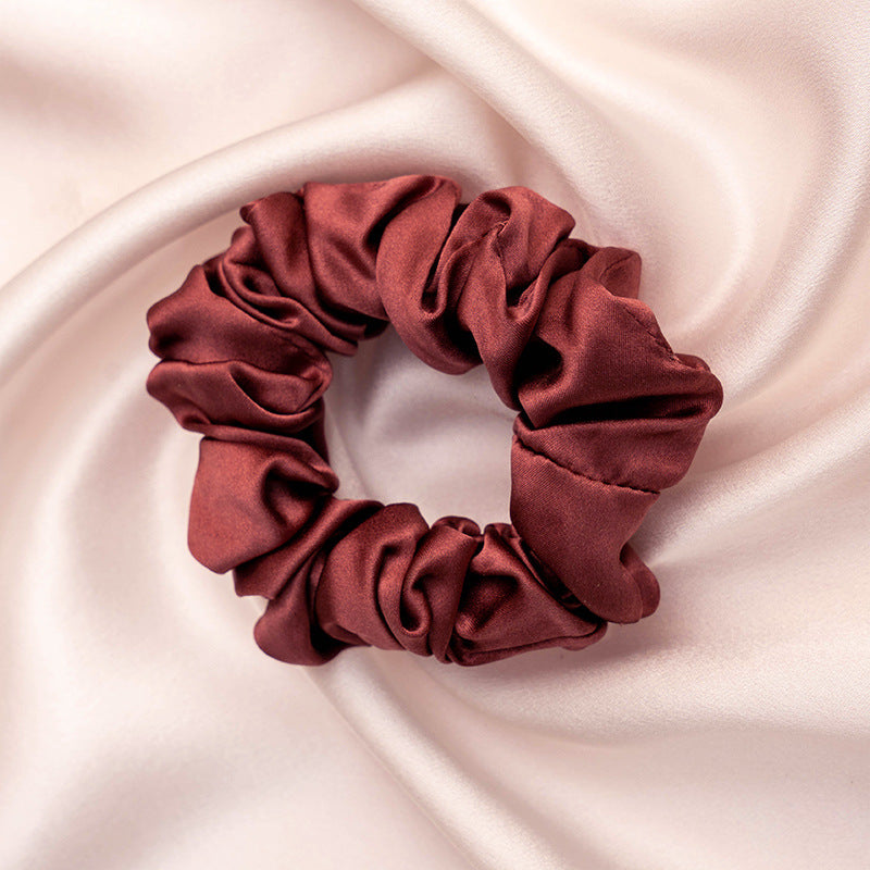 A collection of colorful 100% silk scrunchies-25