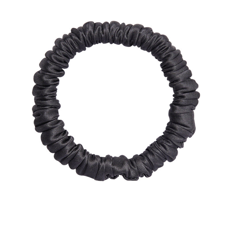 A set of silk scrunchies in black, gray, beige, brown, light blue, pink, and green colors-15