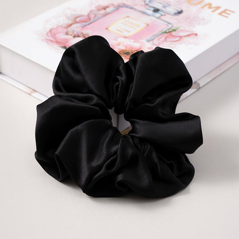 A set of silk scrunchies in various colors including beige, blue, brown, and more-47