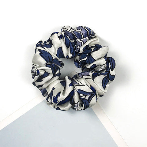 A collection of colorful 100% silk scrunchies-22